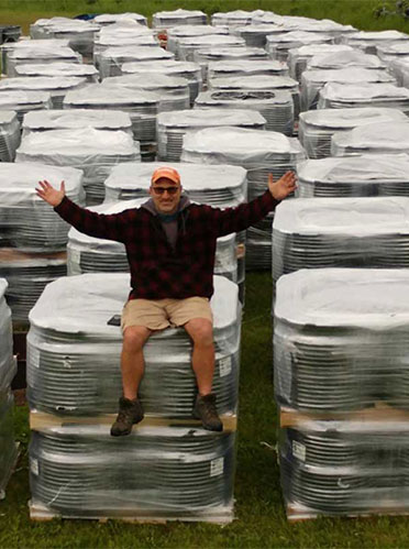 John Tucci of Everblue Lakes with 380 coils of tubes, each 500 feet.